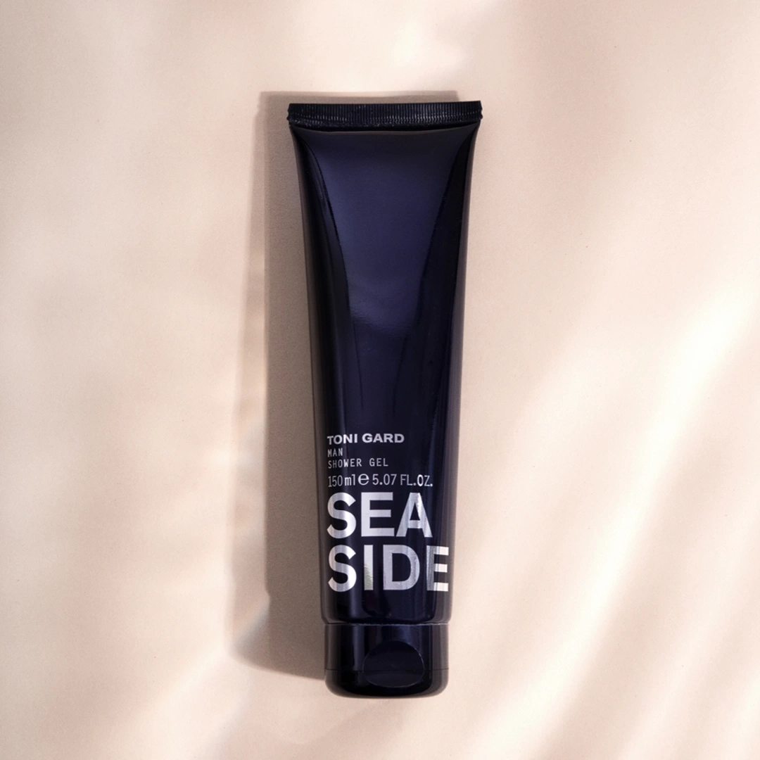 Dunkelblaue Tube mit der Aufschrift 'SEA SIDE' und 'TONI GARD MAN'
