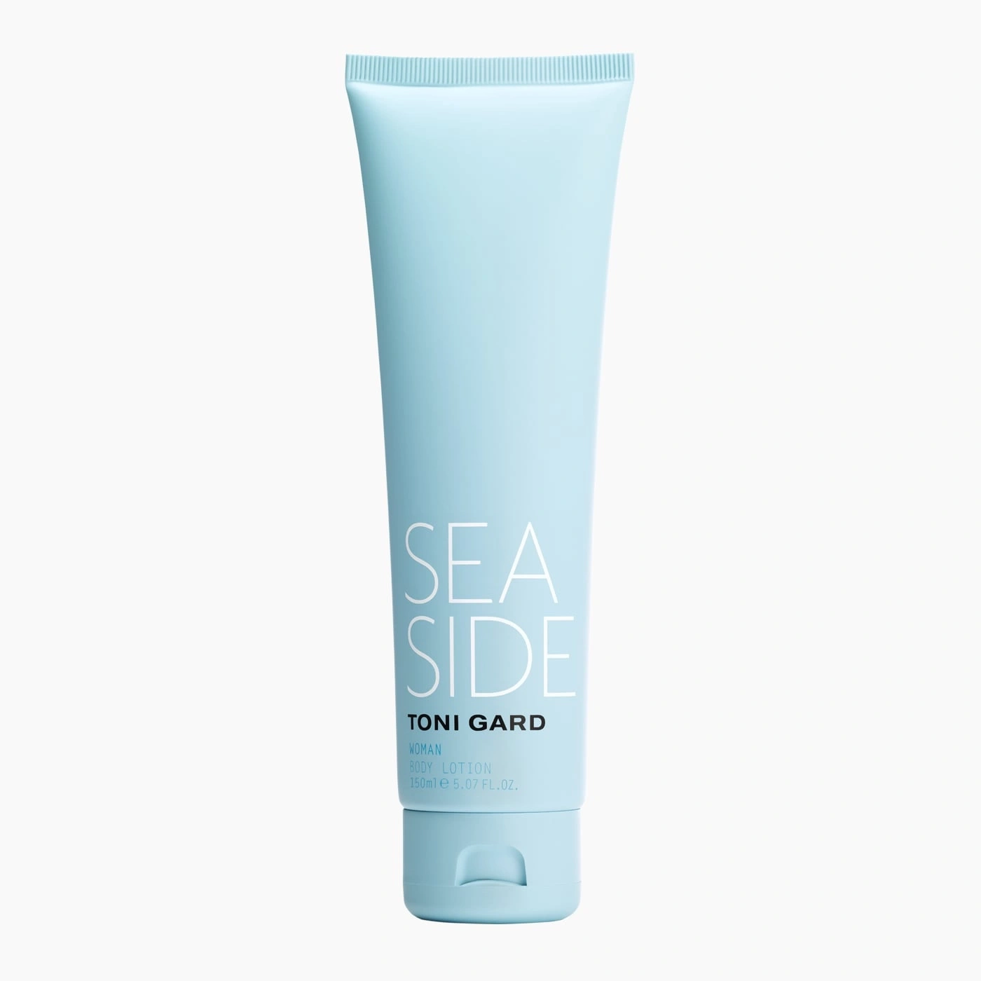Light blue cosmetic product with 'SEA SIDE' and 'TONI GARD' for women.