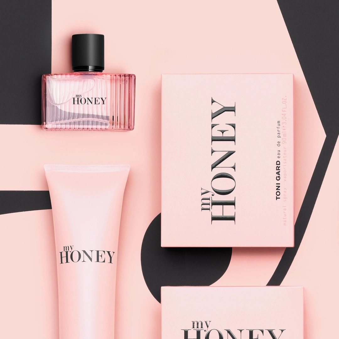 Pink cosmetic products with "my HONEY" text on a pink background.