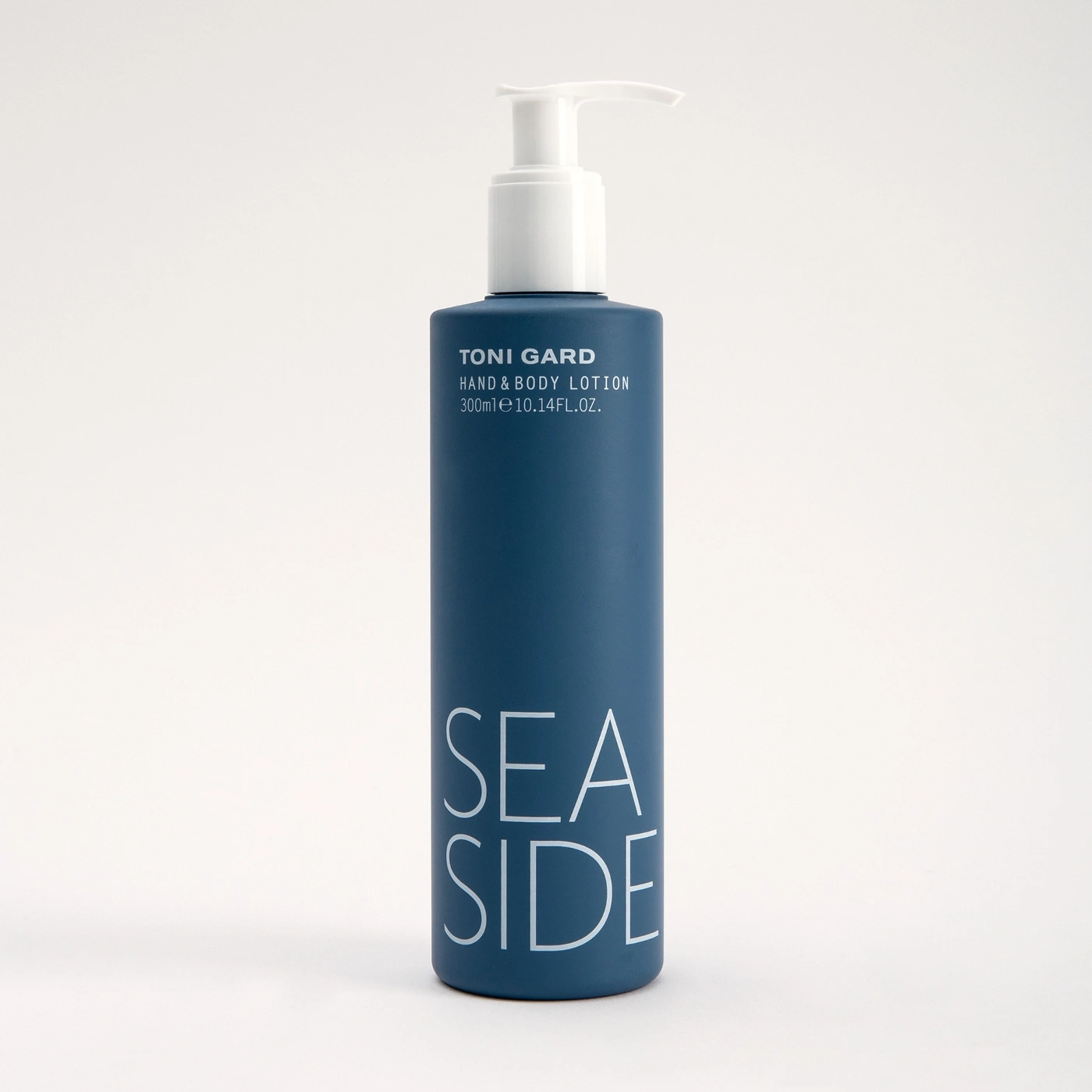 Blue hand and body lotion bottle with white lettering and pump
