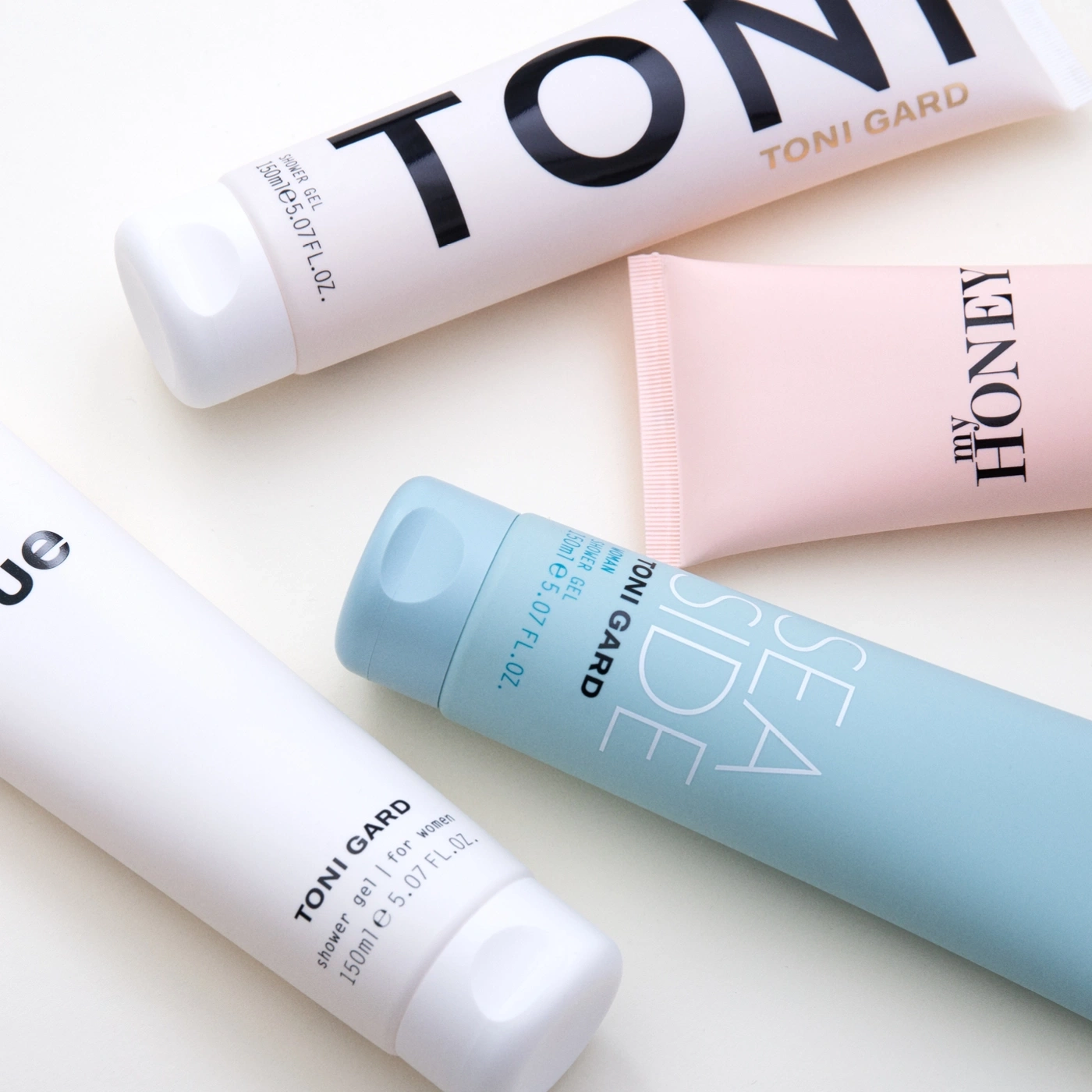 Toni Gard shower gel tubes, various scents, on a light background.