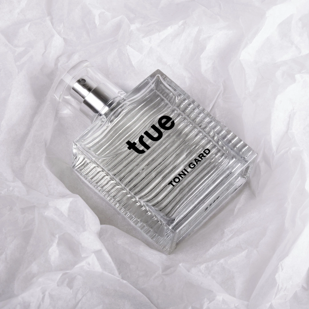 Toni Gard 'true' perfume bottle on white paper, minimalist aesthetic