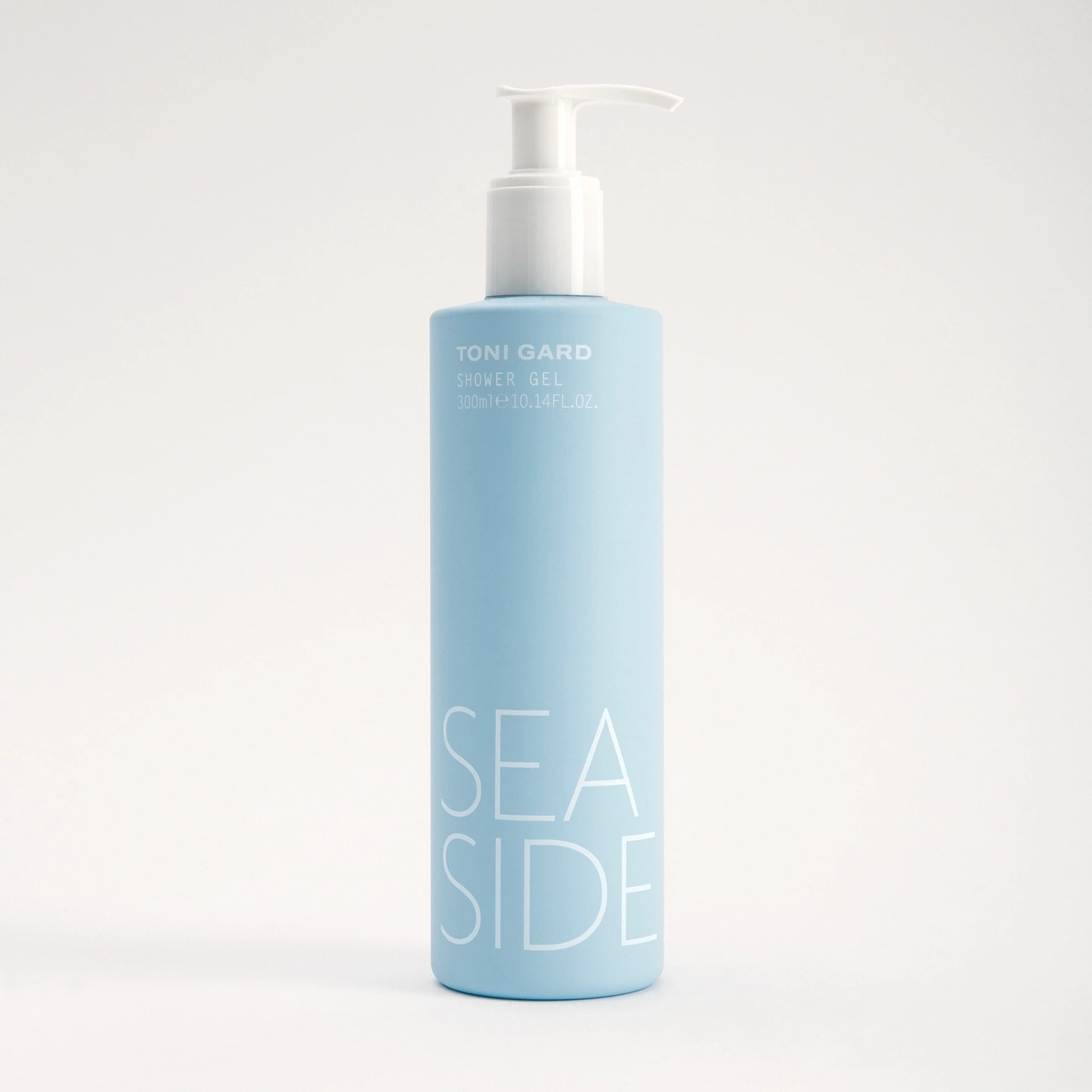 Blue shower gel with white text, product shot, minimalist design