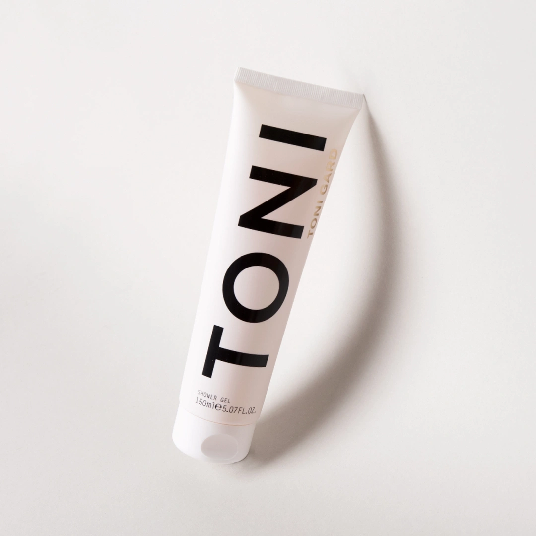 White shower gel tube with black text on a white background.