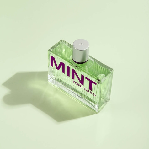 Toni Gard Mint perfume, green liquid, purple text, light green background